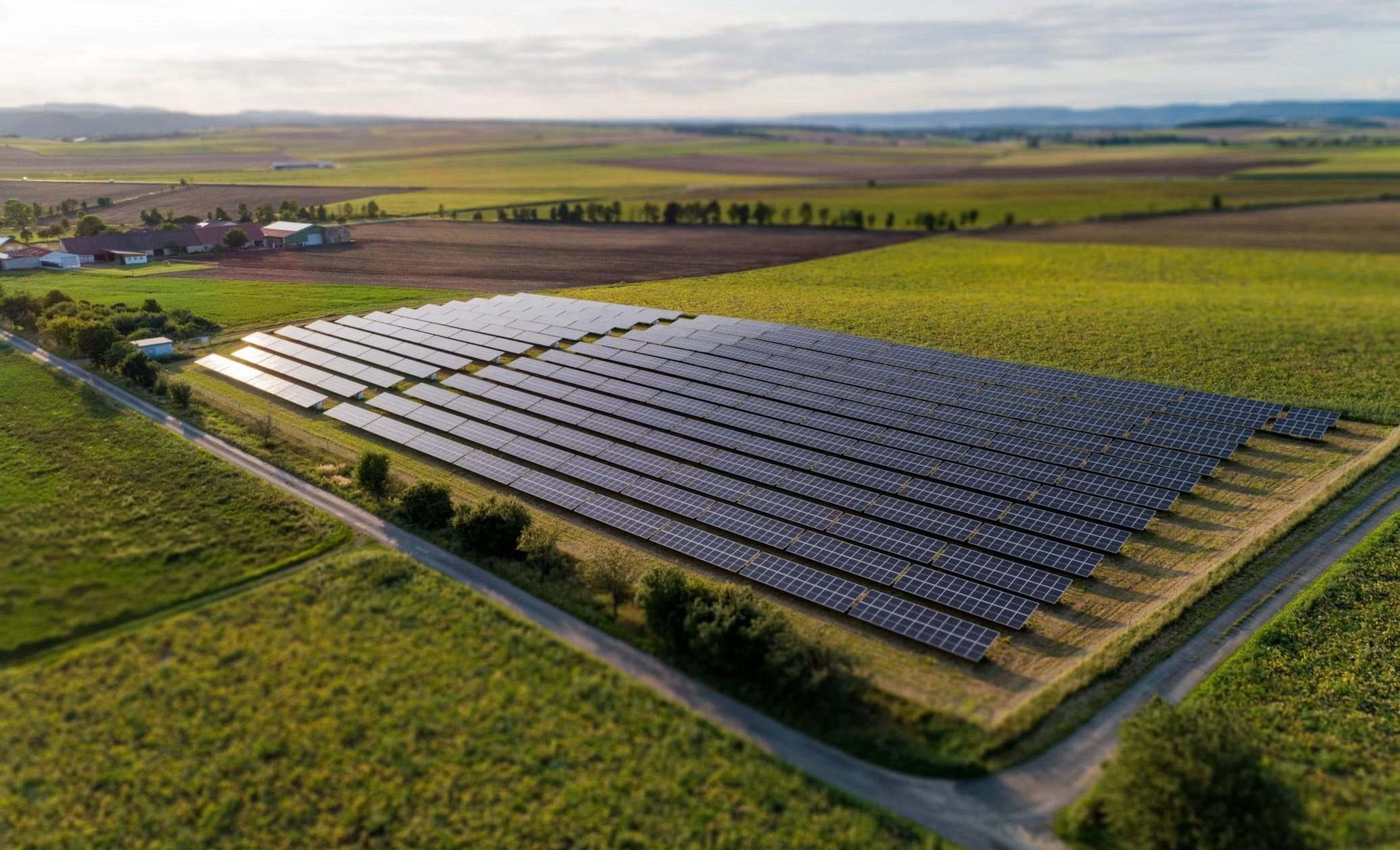 Solar farm among green fields